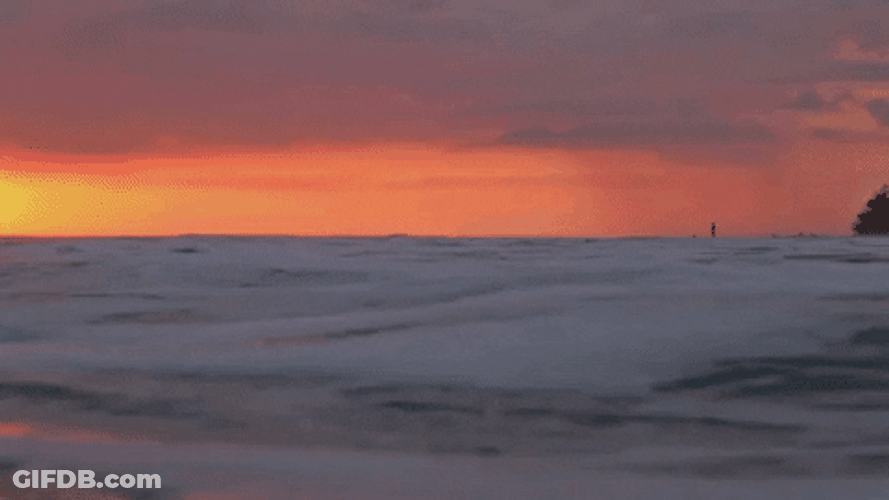 Gentle Ocean Waves At Sunset GIF