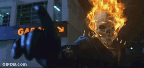 Ghost Rider Is Giving The Middle Finger In Front Of A Building . GIF