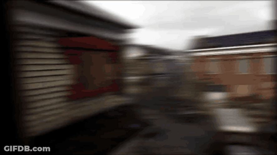 Ghost Town With Neglected Vehicles GIF