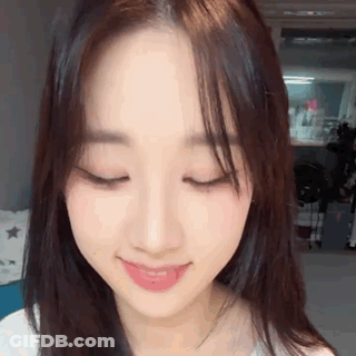 Ghost With Flowers In Mouth Saying Spooky GIF