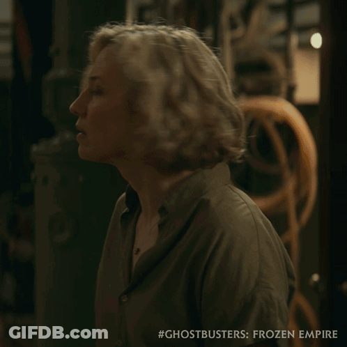 Ghostbusters Frozen Empire Poster Woman In Green Shirt GIF