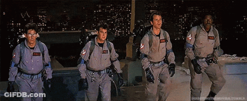 Ghostbusters Walking In Front Of City At Night GIF