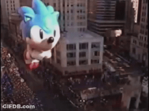 Giant Sonic The Hedgehog Balloon Flying Through City GIF