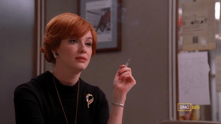 Giggle Christina Hendricks Smoking Laugh GIF
