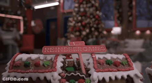 Gingerbread House Reindeer Games Sign GIF