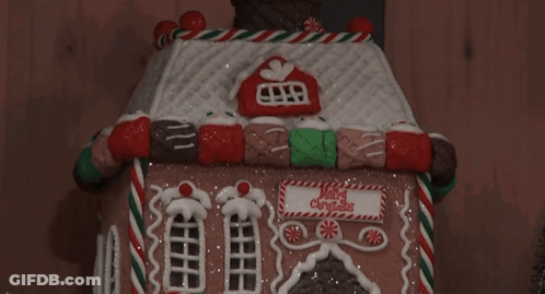 Gingerbread House Saying Merry Christmas GIF