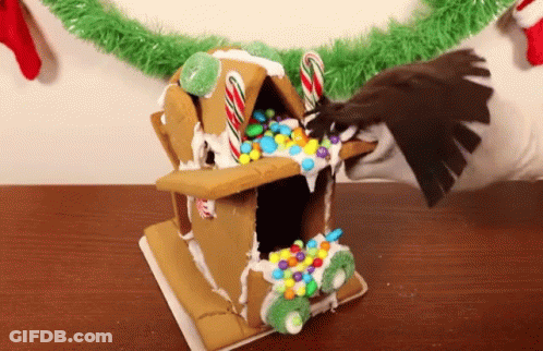 Gingerbread House With Candy Canes GIF