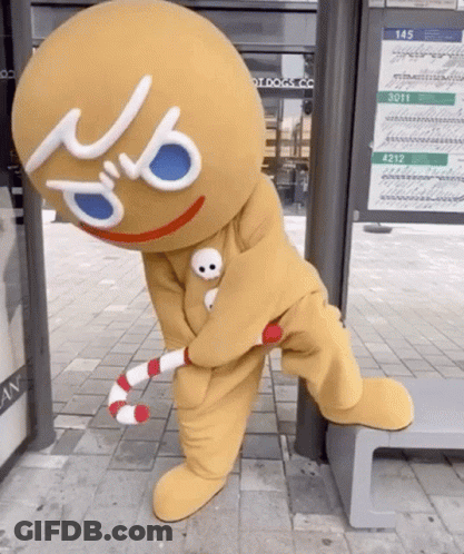 Gingerbread Man Holding Candy Cane GIF