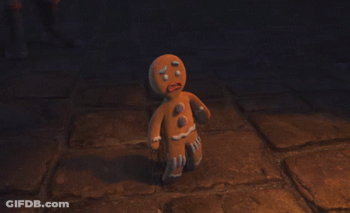 Gingerbread Man Standing On Brick Floor GIF