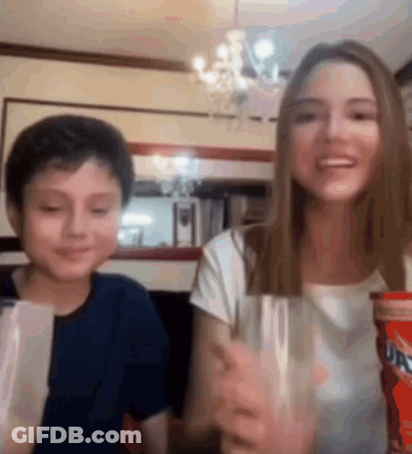 Girl And Boy Holding Soda Glasses GIF