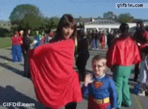 Girl And Boy In Superman Costumes GIF