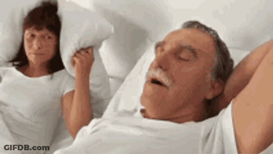 Girl Covering Snoring Man GIF