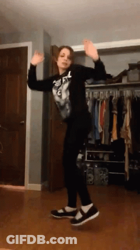 Girl Dancing In Room With Clothes GIF
