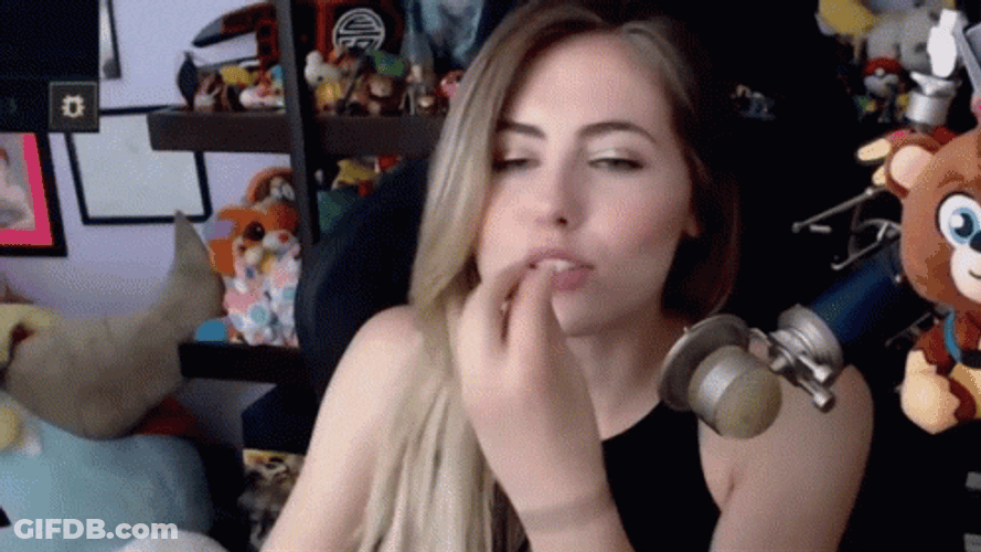 Girl Doing Chef's Kiss While Sitting GIF