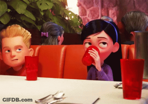 Girl Drinking From Red Cup At Table GIF