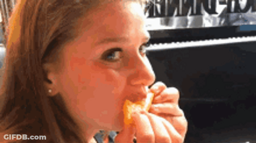 Girl Eating Juicy Orange GIF