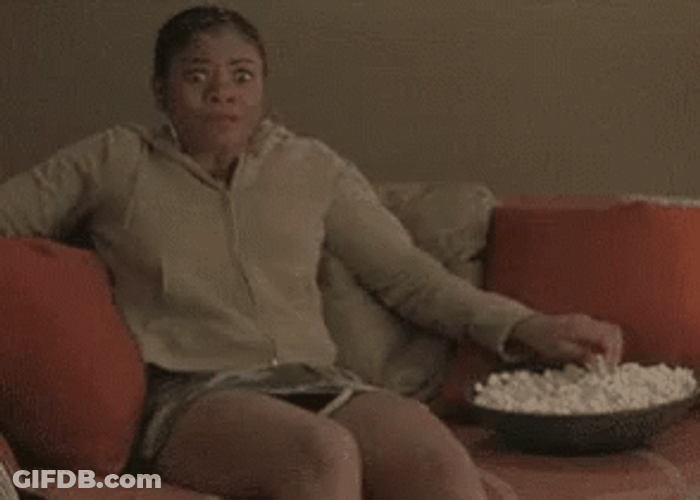Girl Eating Popcorn While Watching GIF