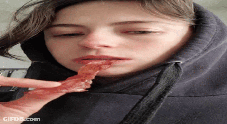 Girl Enjoying Her Bacon GIF