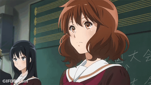 Girl Eyes Closed In Front Of Chinese Blackboard GIF