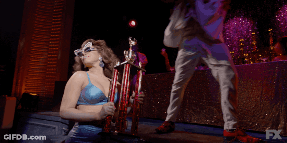 Girl Flexing Her Trophy GIF