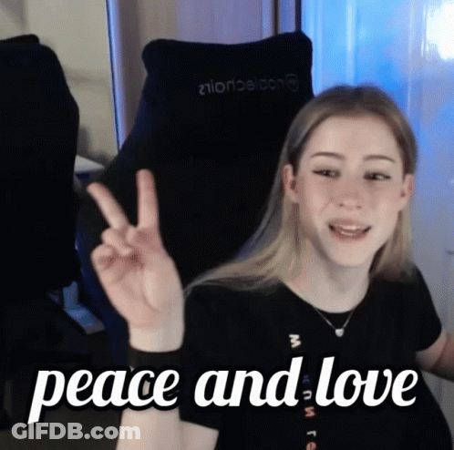 Girl Giving Peace Sign Saying Peace And Love GIF
