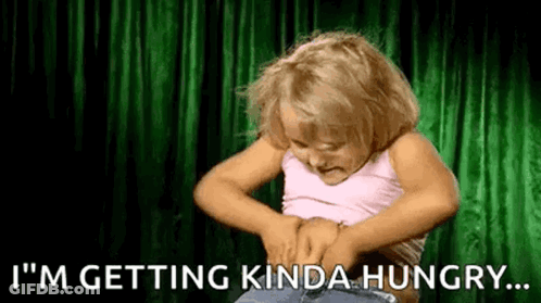 Girl Holding Belly Saying I'm Getting Hungry GIF