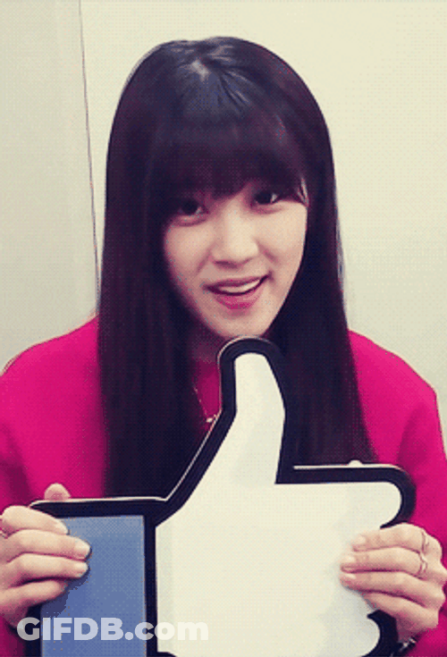 Girl Holding Big Like Button GIF