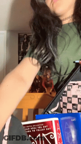Girl Holding Book Saying A GIF