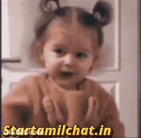 Girl Holding Cup In Front Of Startamilchat.in Sign GIF
