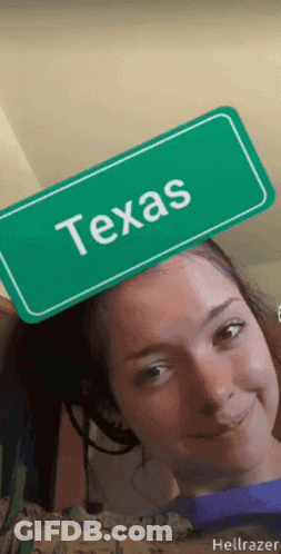 Girl Holding Green Sign Saying Texas On Head GIF