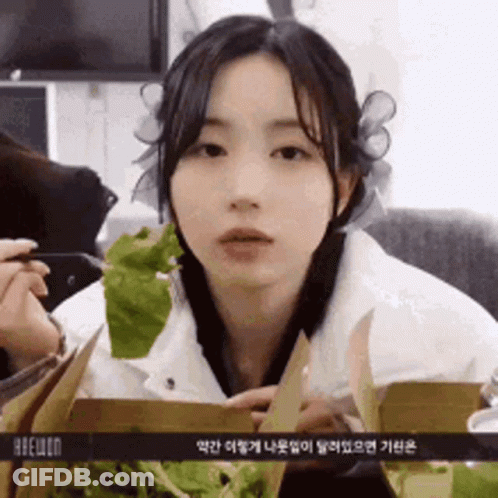 Girl Holding Lettuce GIF