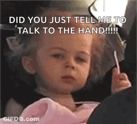Girl Holding Lollipop Saying Talk To The Hand GIF