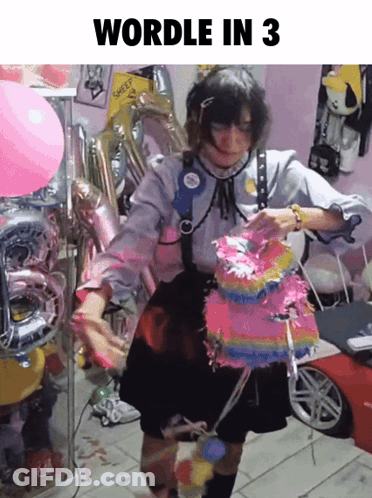 Girl Holding Pinata In Front Of Balloons Wordle In 3 GIF