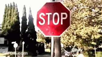 Girl Holding Stop Sign GIF