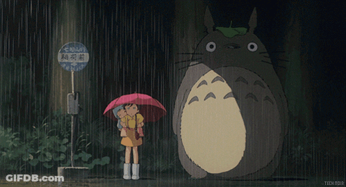 Girl Holding Umbrella Next To Totoro GIF