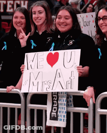 Girl Holding We Love U Mrs Art Sign GIF