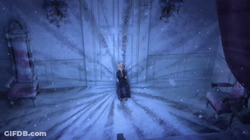 Girl In Black Dress Standing In Snow GIF