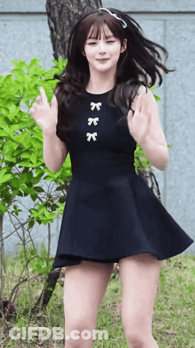 Girl In Black Dress With Three Bows GIF