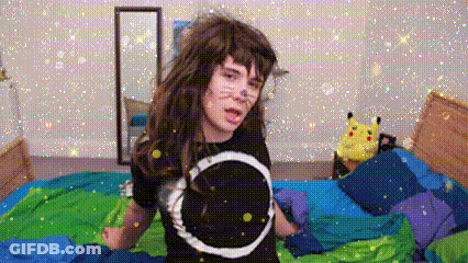 Girl In Black Shirt Standing On Bed With Pikachu Stuffed Animal GIF