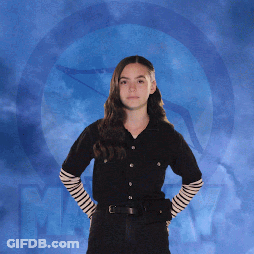 Girl In Black Shirt With Striped Sleeves And Letter M GIF