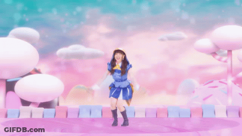 Girl In Blue And Yellow Outfit Jumping With Arms Up GIF