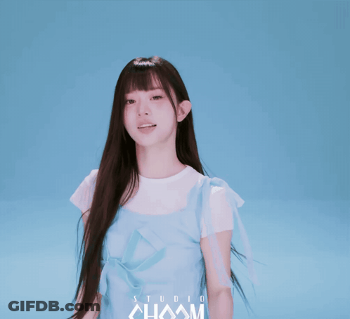 Girl In Blue Dress In Front Of Studio Chaam Background GIF