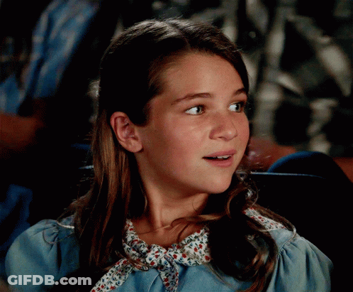 Girl In Blue Dress With Floral Collar GIF