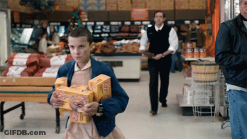 Girl In Blue Jacket Carrying Boxes Of Eggs GIF