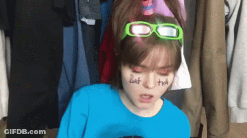 Girl In Blue Shirt And Green Glasses Saying But GIF
