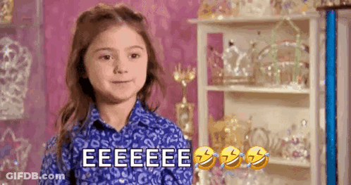 Girl In Blue Shirt Making Funny Face GIF
