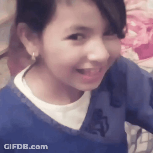 Girl In Blue Shirt With Letter A Smiling GIF