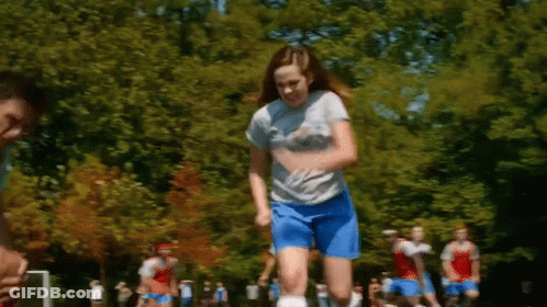 Girl In Blue Shorts Jumping While Playing Soccer GIF