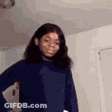 Girl In Blue Sweater Making Funny Face GIF
