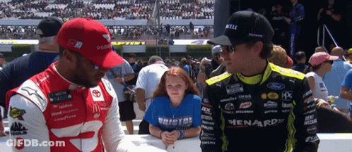 Girl In Bristol Shirt Next To Man In Ford Uniform GIF